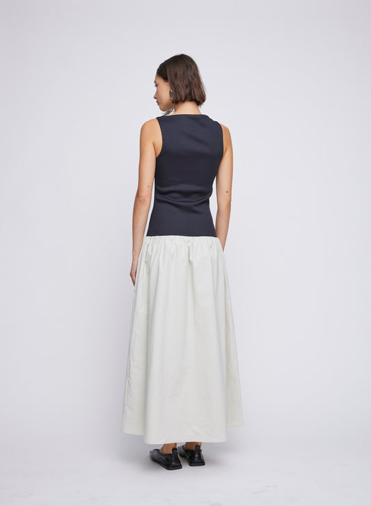 Dress up in style with ANNA QUAN'S Boat Neck Mixed Media Dress ‚Äì a perfect blend of sophistication and comfort. The boat neck adds a touch of elegance to this versatile piece, ideal for a variety of occasions - easily taking you from day to dinner. Dinner dress, day dress, every day dress, mixed media dress, cotton skirt, stretch top.