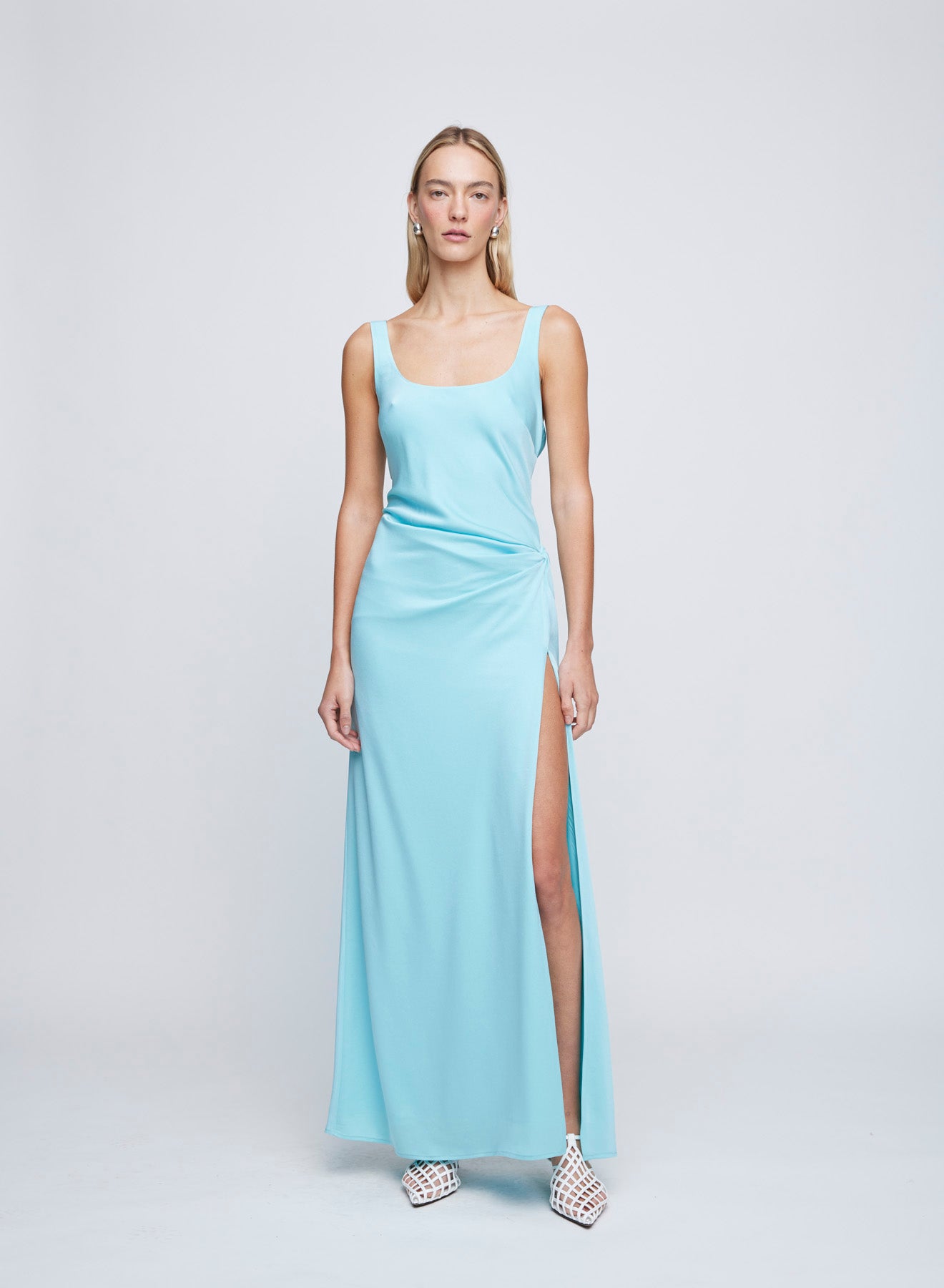The ANNA QUAN Etta Dress in Electric Teal is a nod to the 90's and red carpet dressing. A bias cut satin slip maxi dress skims the body whilst the side split compliments the gathered waist.