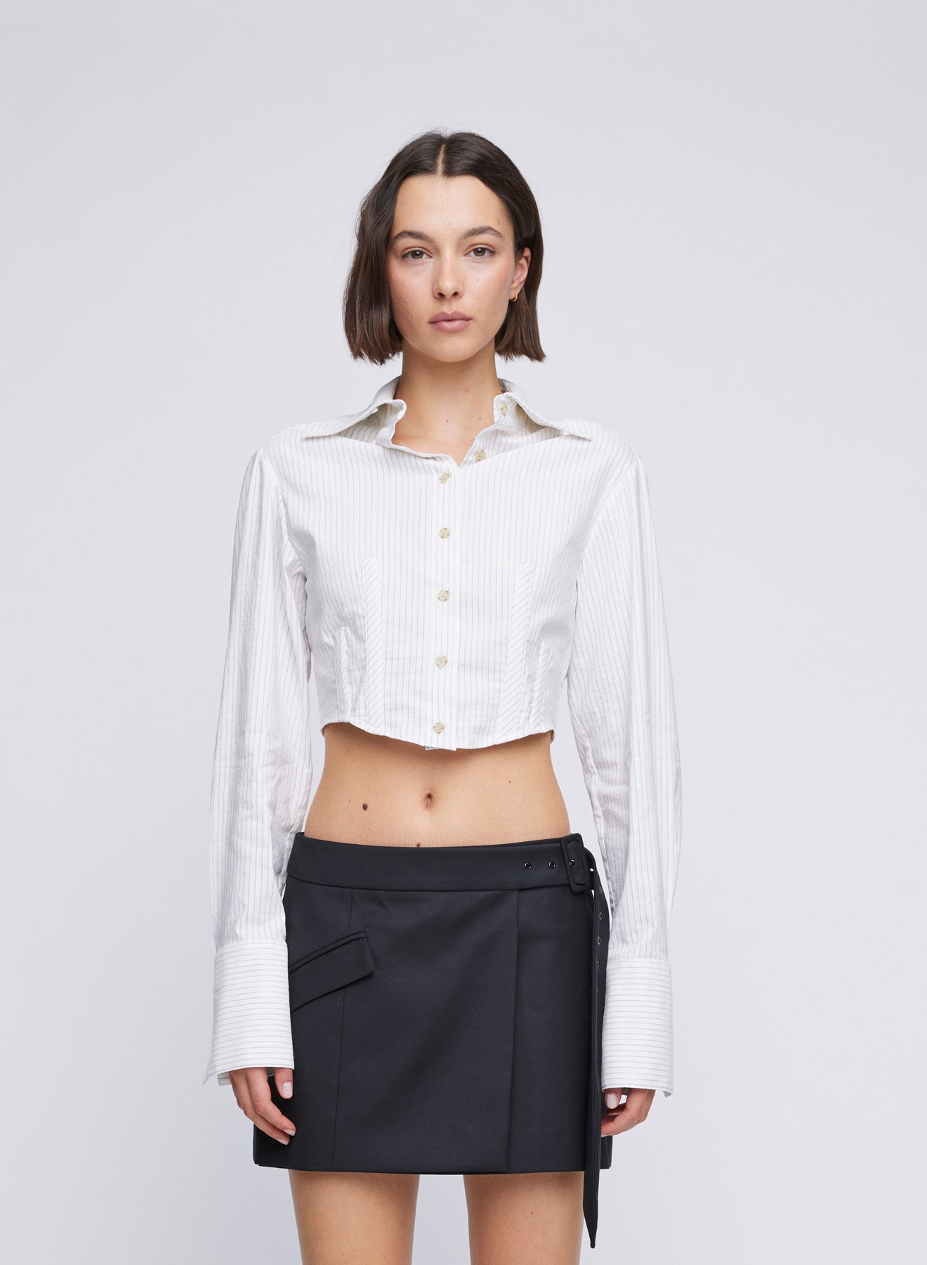 ANNA QUAN Cropped Stretch Cotton Shirt, enhanced with boning inserts for a contemporary twist. This cropped shirt is a statement piece, designed to elevate your everyday dressing with its unique boning inserts. White shirts, work shirts, cool work shirts, everyday work shirts, everyday cotton shirts, cropped shirts, oversized cropped shirt.