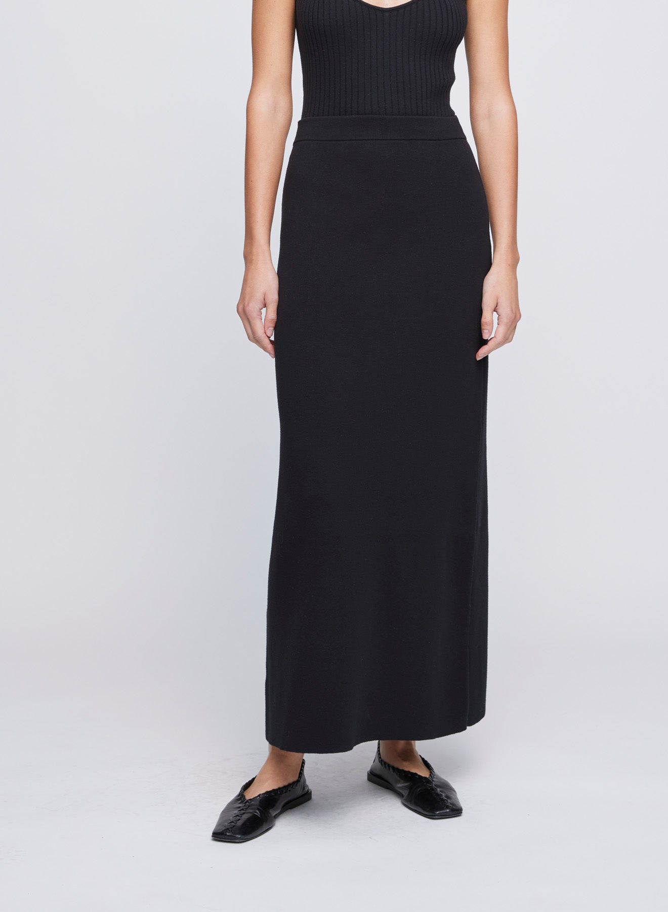 The ANNA QUAN Ines Skirt in Raven is a 100% cotton knit skirt, designed with an elasticated waistband for ease of styling.