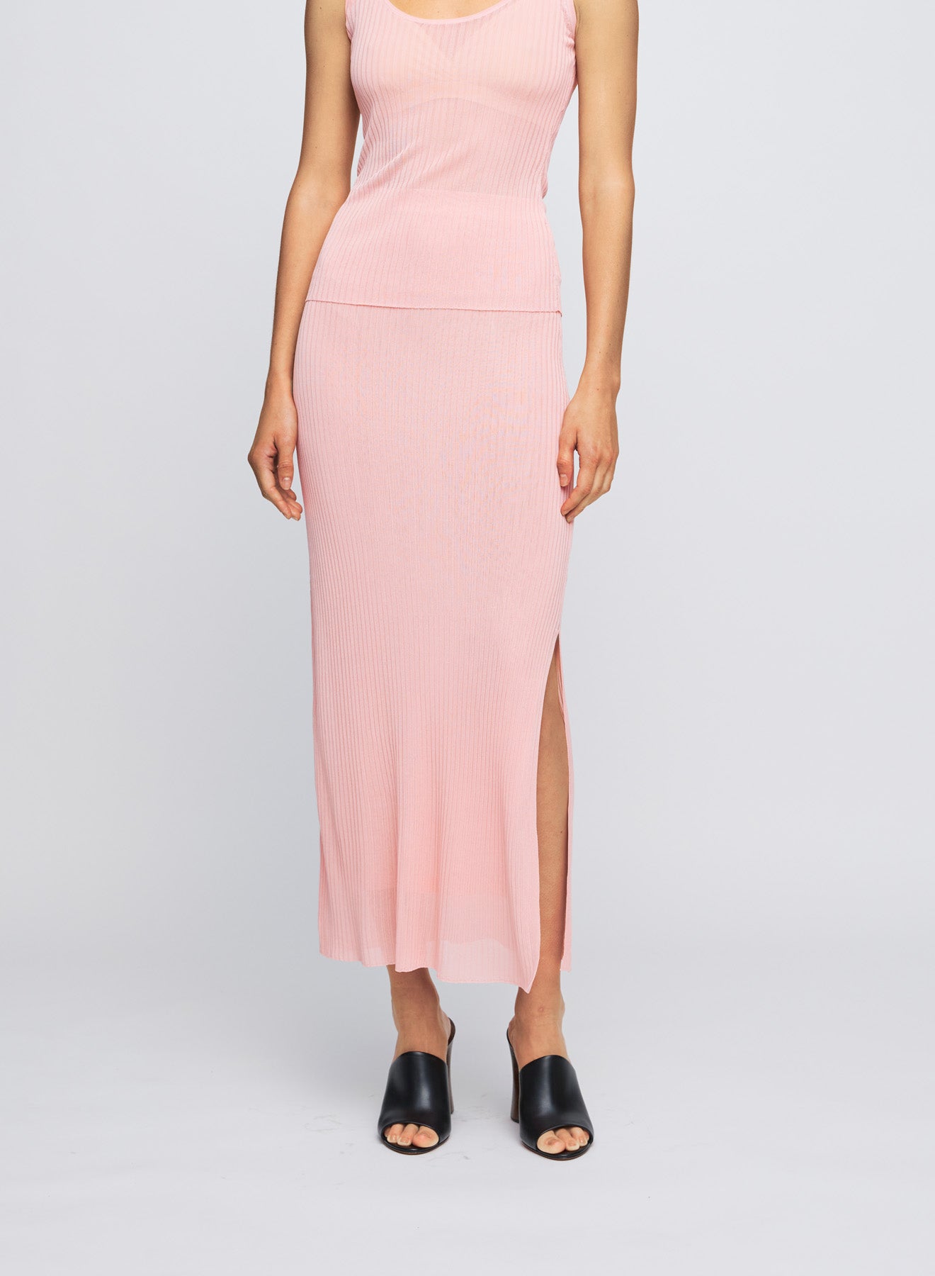 The Anna Quan Carrie Skirt in Sakura is a midi skirt with a side split that is cut in a delicate viscose fabric with stretch for ease of movement and effortless styling.