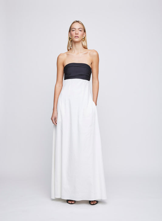 The ANNA QUAN Marcia Dress in Ivory Linen is a strapless maxi dress with a ruched jersey bust, and linen skirt in an empire silhouette.