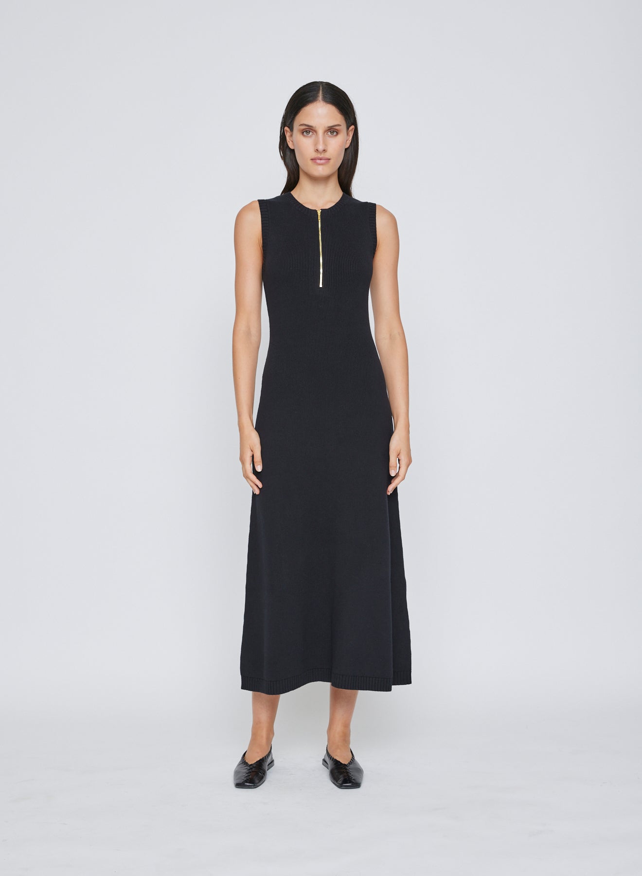 The ANNA QUAN Jennie Dress in Raven is an elevated day to night midi dress, cut in 100% cotton knit. Featuring a sleeveless design and zip closure at the bust.