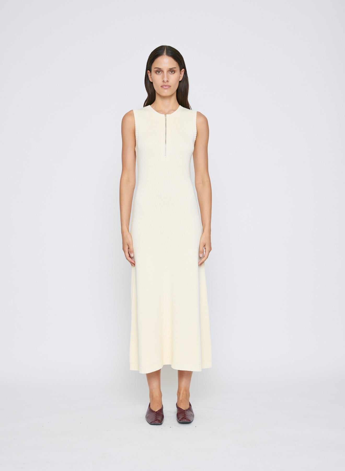 The ANNA QUAN Jennie Dress in Silence is an elevated day to night midi dress, cut in 100% cotton knit. Featuring a sleeveless design and zip closure at the bust.