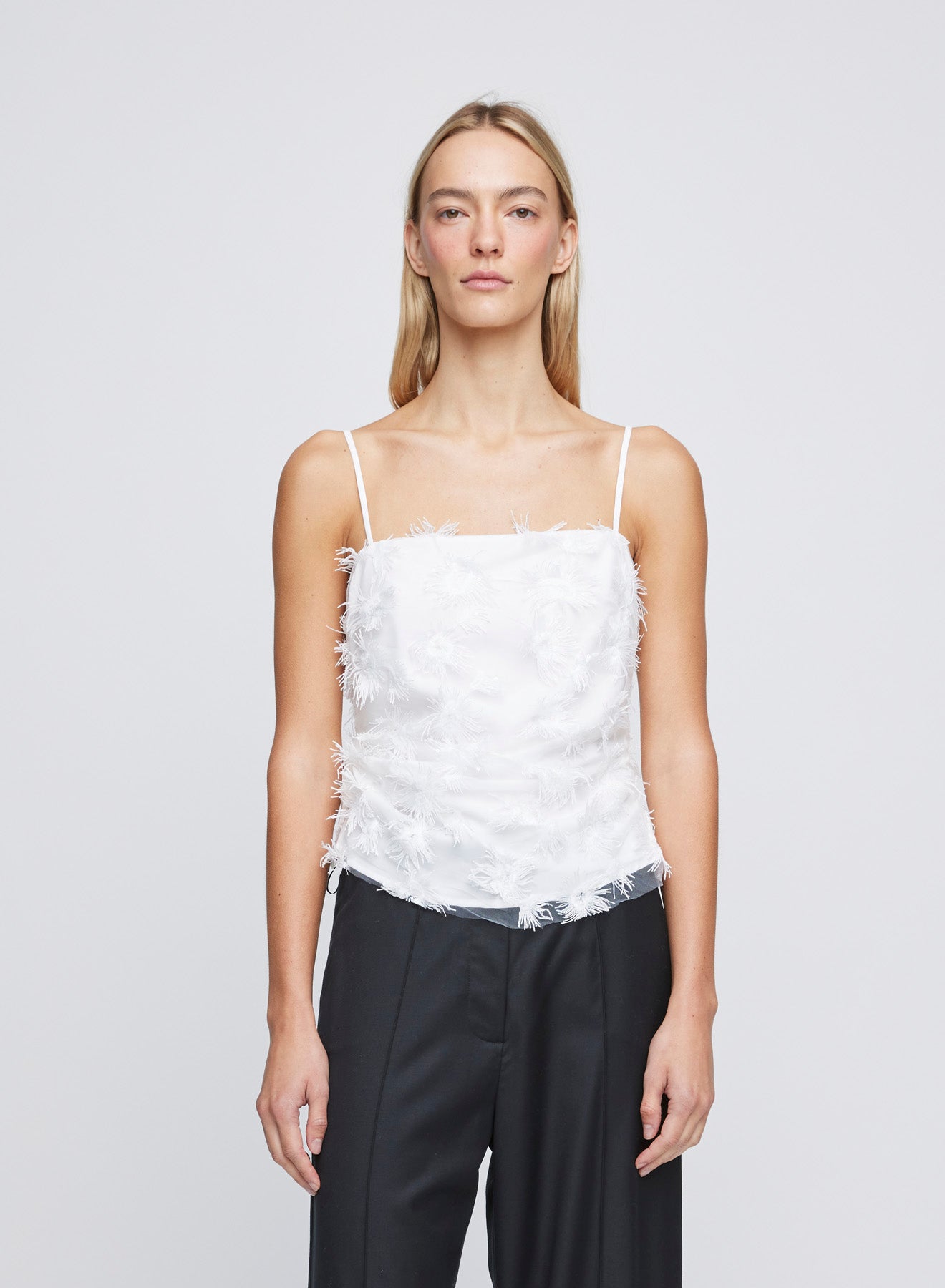 The ANNA QUAN Nadine Top is crafted in a Dandelion fabric. This fully lined, cropped in length top is lightweight and easy to wear. Detailed with a raw hem finish and a delicate square neckline.